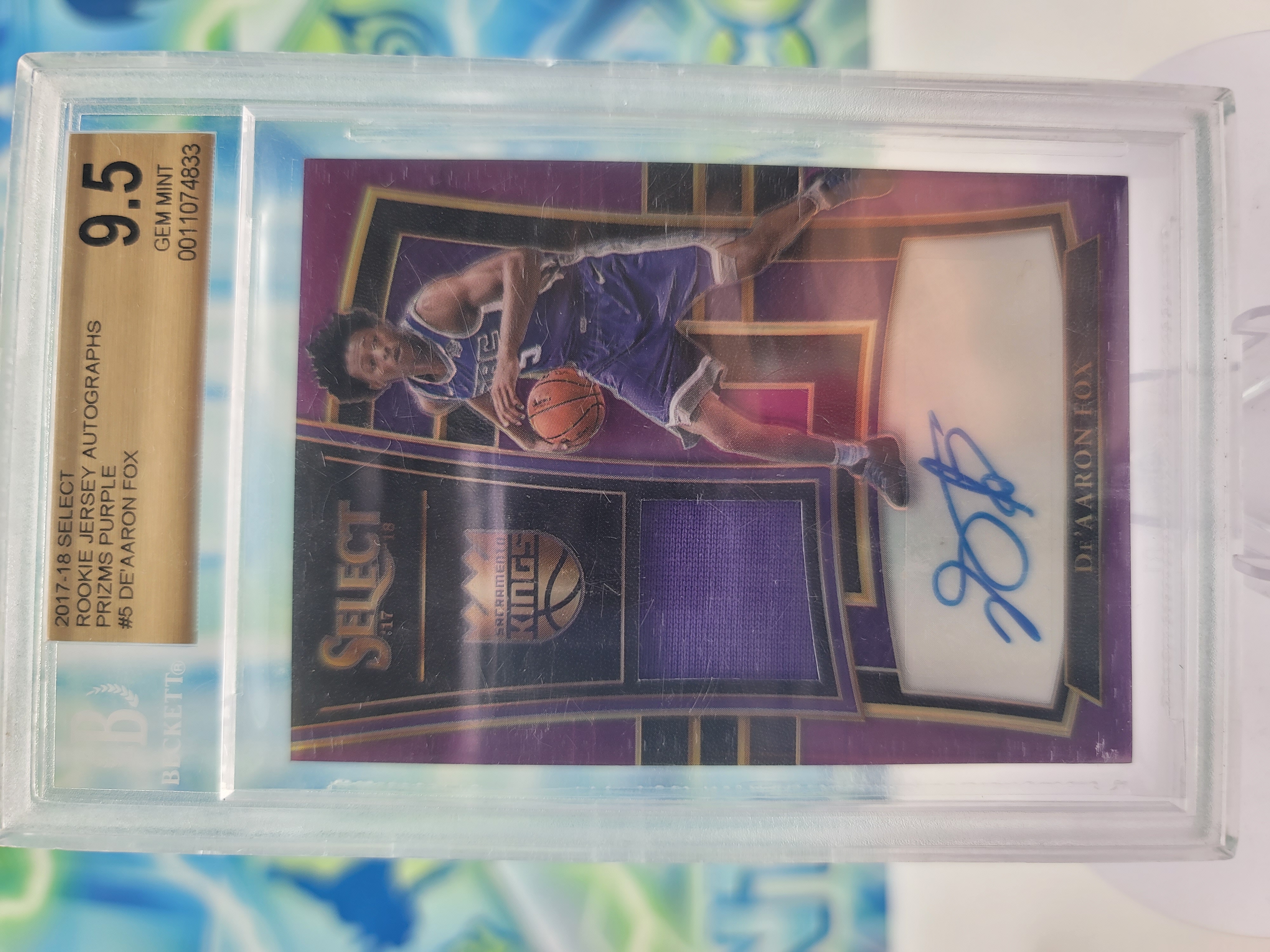 2018 Panini Select De'Aaron Fox — 2018 Panini Select Purple Prizm De'Aaron Fox Patch Autograph #64 of 99 Beckett 9.5