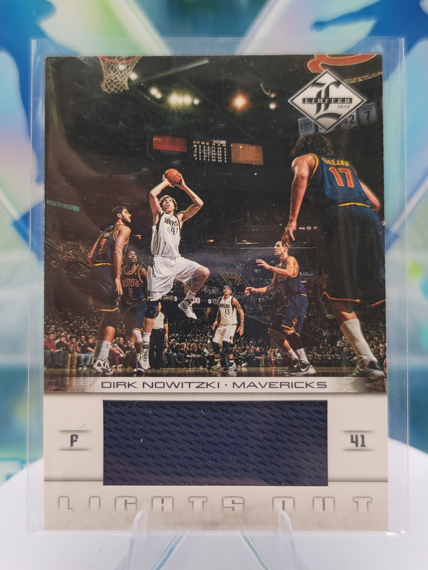 2009 Panini Limited Dirk Nowitzki — 2009 Panini Limited Lights Out Patch Dirk Nowitzki #157 of 199 Patch/Memorabilia