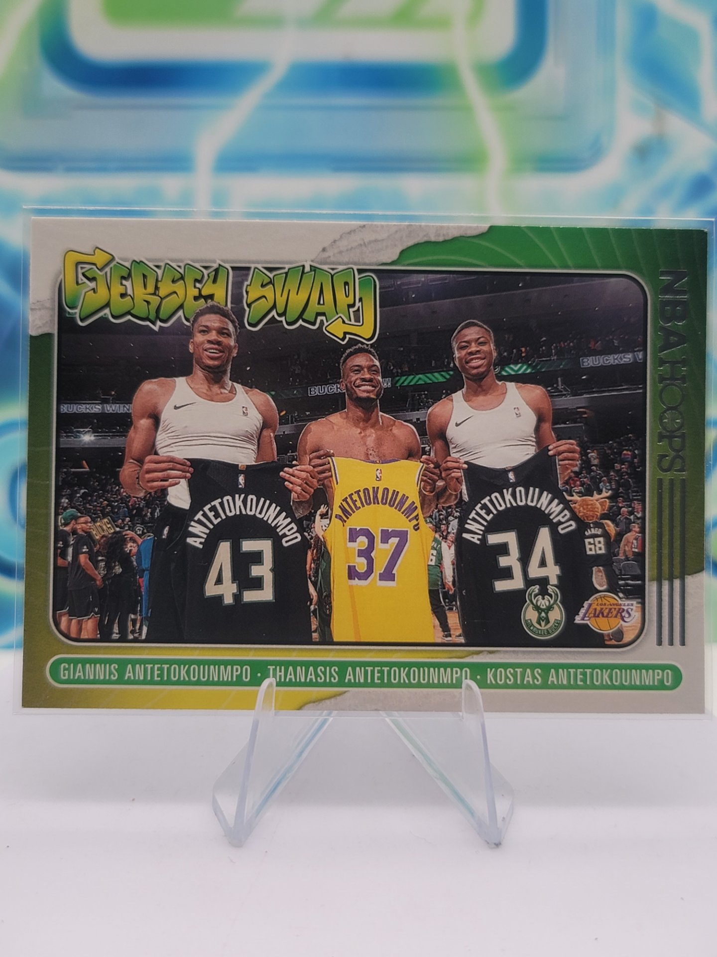 2021 Panini NBA Hoops Giannis Antetokounmpo, Thanasis Antetokounmpo & Kostas Antetokounmpo — 2021 Panini NBA Hoops Jersey Swap Giannis Antetokounmpo, Thanasis Antetokounmpo & Kostas Antetokounmpo